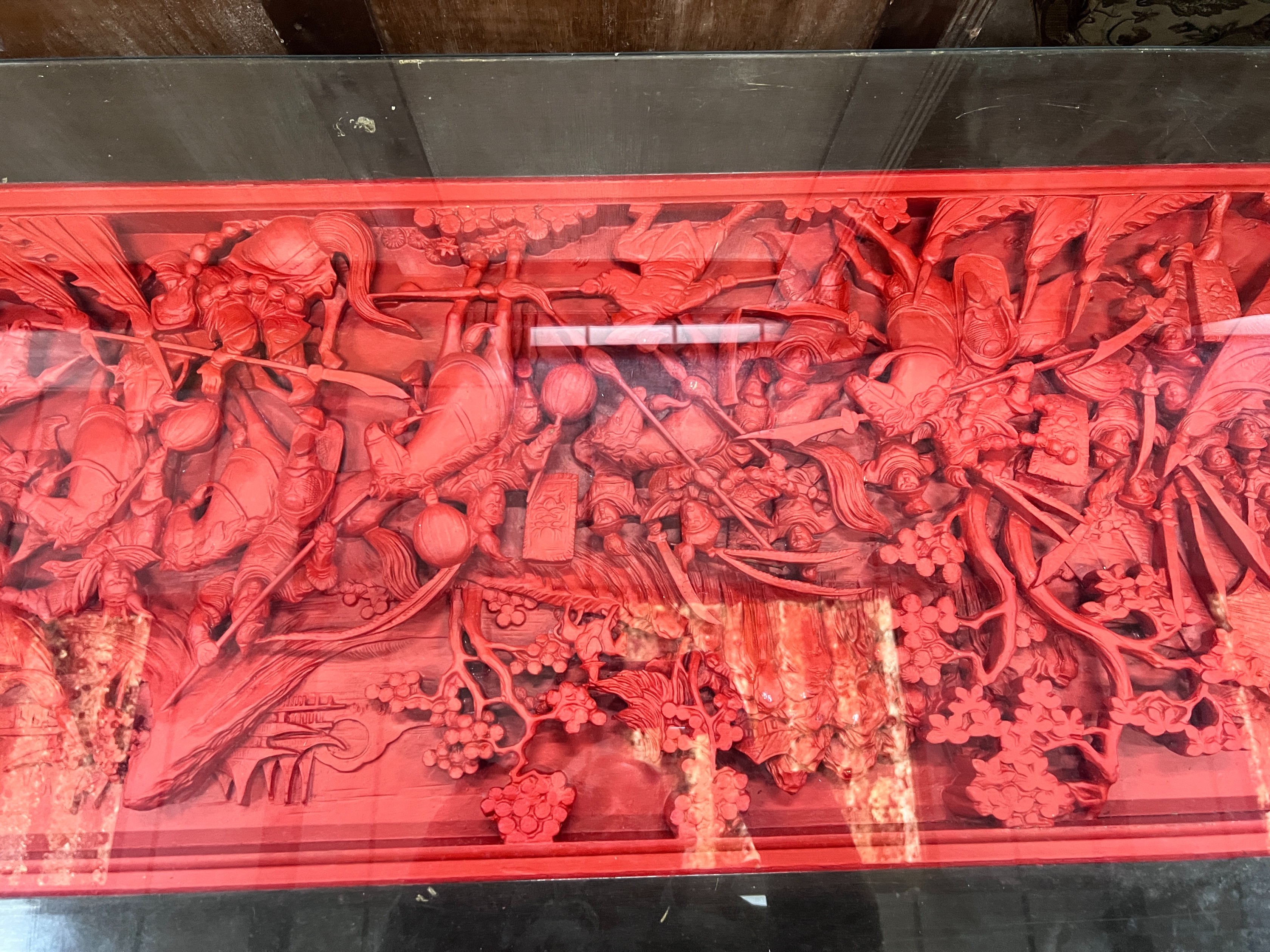 An Asian red stained hardwood coffee table, length 142cm *Please note the sale commences at 9am.